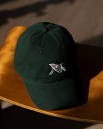 Photo Image of Verdin Dog Care Cotton Baseball Hat Sitting on a Wood Bench
